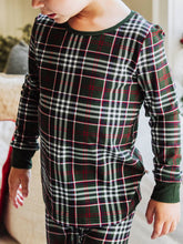 These fitted traditional plaid pajamas are a cozy holiday essential, featuring a classic green plaid pajama set design inspired by timeless tartan Christmas style. Made from soft, stretchy fabric, this holiday plaid sleepwear offers a comfortable, form-fitting feel that’s perfect for lounging or festive family mornings. The red and green plaid pattern brings traditional charm, while the snug fit adds a modern twist to your favorite classic tartan pajamas.